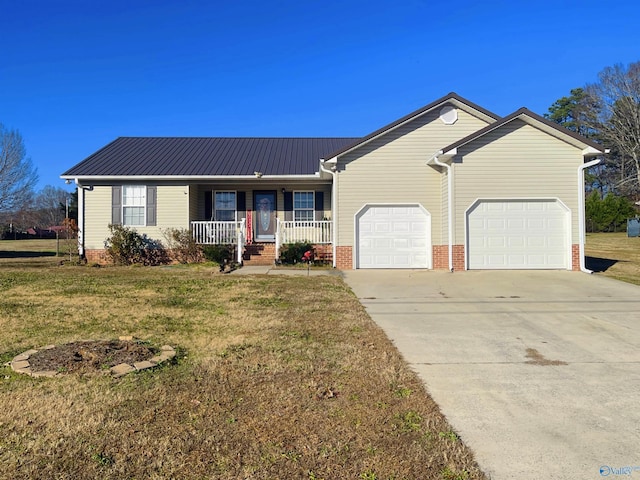 single story home featuring a front yard, a porch, and a garage