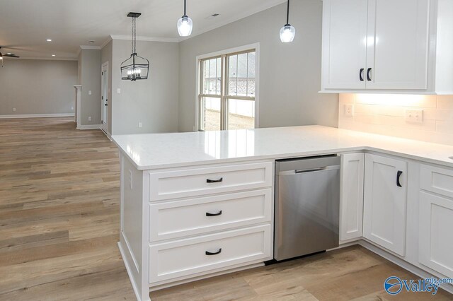 kitchen with stainless steel dishwasher, tasteful backsplash, light hardwood / wood-style floors, and decorative light fixtures