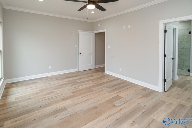 empty room with light hardwood / wood-style floors, ornamental molding, and ceiling fan