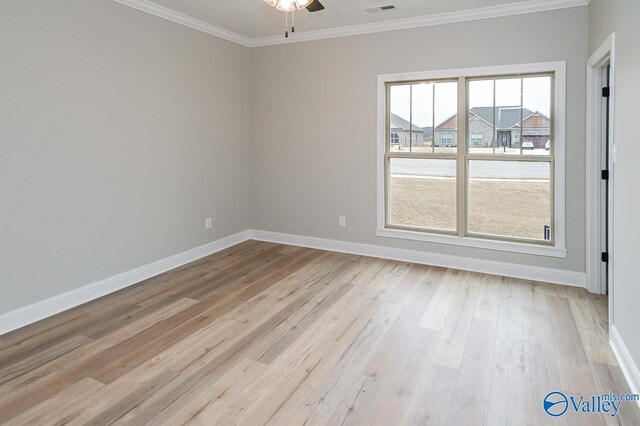 empty room with ceiling fan, light hardwood / wood-style floors, crown molding, and plenty of natural light