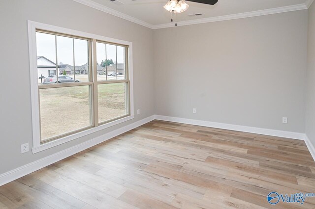 unfurnished room featuring light hardwood / wood-style floors, a wealth of natural light, and ceiling fan