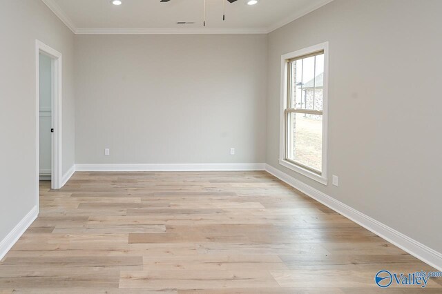 spare room featuring crown molding, ceiling fan, and light hardwood / wood-style floors