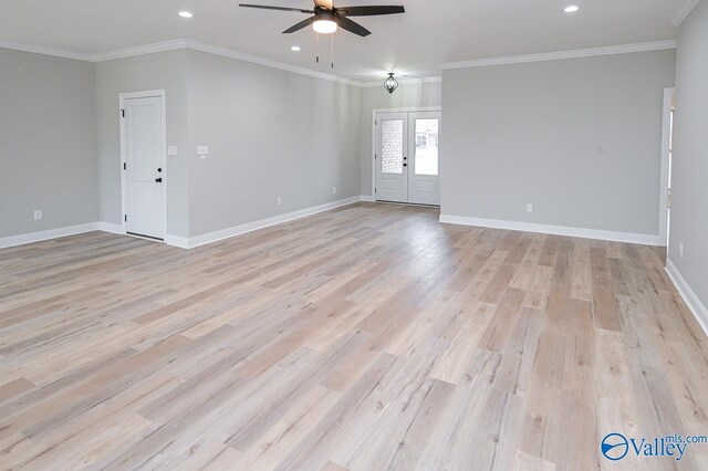 empty room with crown molding, ceiling fan, and light hardwood / wood-style floors