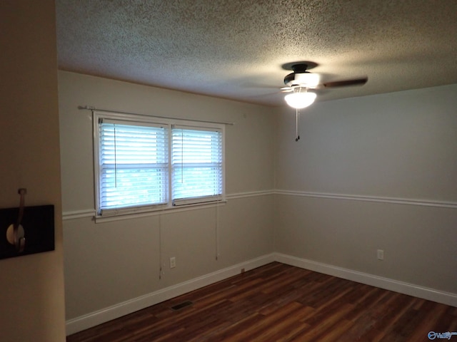 724 Frost St SW, Hartselle, AL 35640 - unfurnished room featuring a textured ceiling, dark wood-style flooring, and ceiling fan