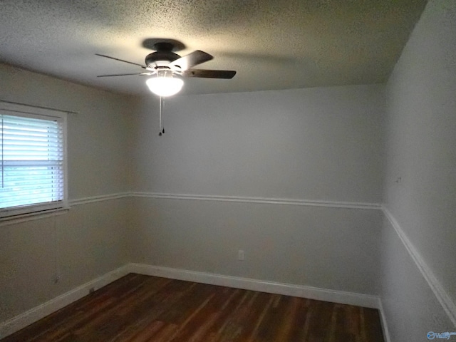 724 Frost St SW, Hartselle, AL 35640 - spare room with dark wood-style floors, a textured ceiling, and ceiling fan