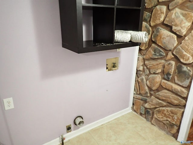 724 Frost St SW, Hartselle, AL 35640 - laundry area with washer hookup, hookup for an electric dryer, hookup for a gas dryer, and tile patterned flooring