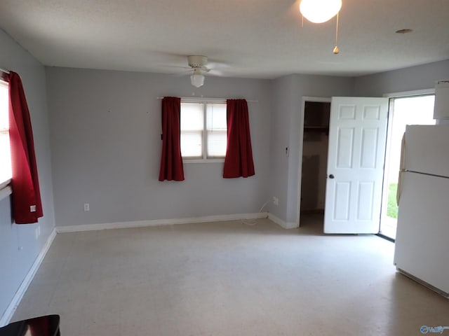 724 Frost St SW, Hartselle, AL 35640 - empty room featuring plenty of natural light and a ceiling fan