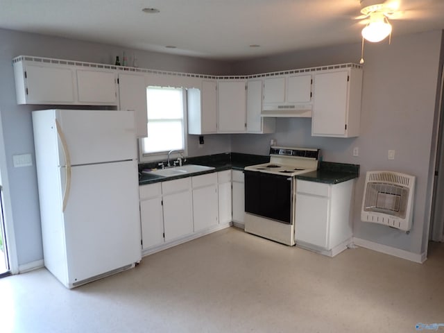 724 Frost St SW, Hartselle, AL 35640 - kitchen featuring white appliances, heating unit, under cabinet range hood, and dark countertops