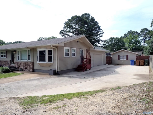 724 Frost St SW, Hartselle, AL 35640 - view of front facade with concrete driveway and an attached garage