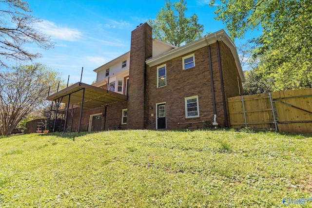 back of house with a yard