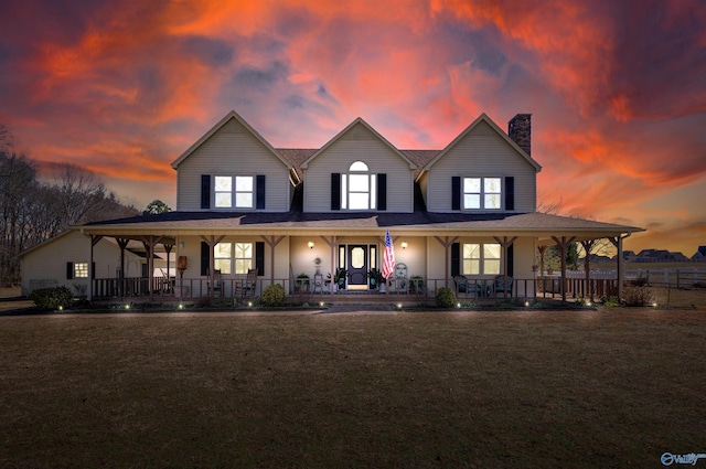 16904 Linton Rd, Athens, AL 35613 - farmhouse inspired home with a chimney, a porch, and a lawn