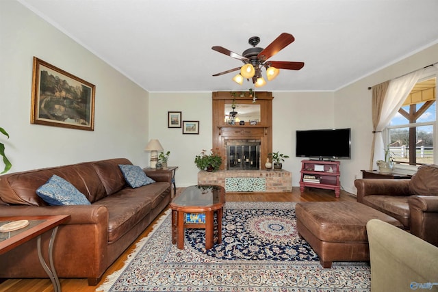 16904 Linton Rd, Athens, AL 35613 - living area with wood finished floors, ceiling fan, crown molding, and a fireplace