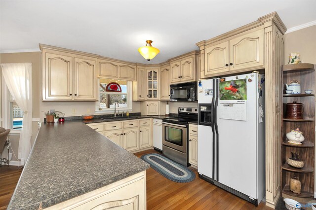 16904 Linton Rd, Athens, AL 35613 - kitchen with stainless steel electric stove, white fridge with ice dispenser, black microwave, dark countertops, and ornamental molding