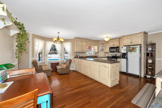 16904 Linton Rd, Athens, AL 35613 - kitchen with white fridge with ice dispenser, electric stove, black microwave, a sink, and a chandelier