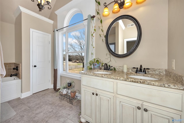16904 Linton Rd, Athens, AL 35613 - bathroom featuring double vanity, plenty of natural light, a garden tub, and baseboards