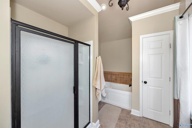 16904 Linton Rd, Athens, AL 35613 - bathroom featuring a stall shower, a bath, and tile patterned floors