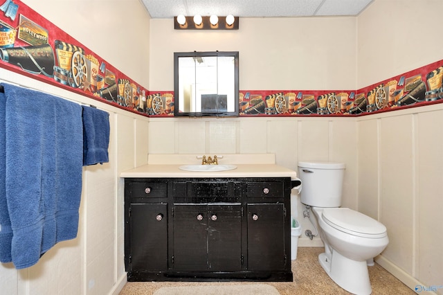 16904 Linton Rd, Athens, AL 35613 - bathroom featuring a wainscoted wall, vanity, and toilet