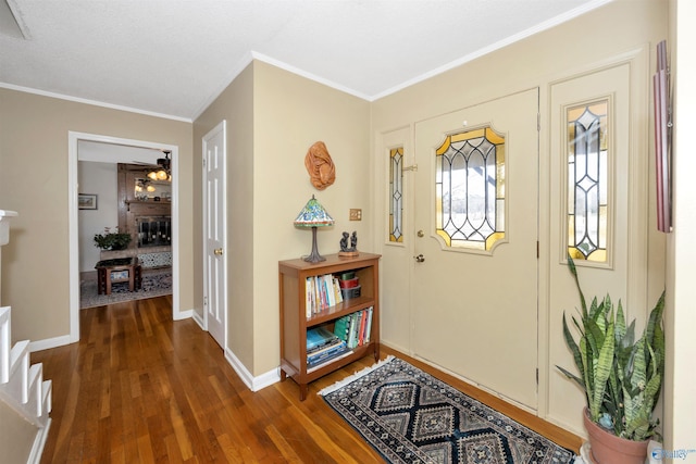 16904 Linton Rd, Athens, AL 35613 - foyer with dark wood-type flooring, ornamental molding, baseboards, and a ceiling fan