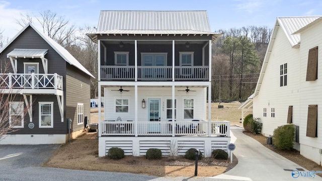 view of front of home featuring a ceiling fan, crawl space, metal roof, and driveway