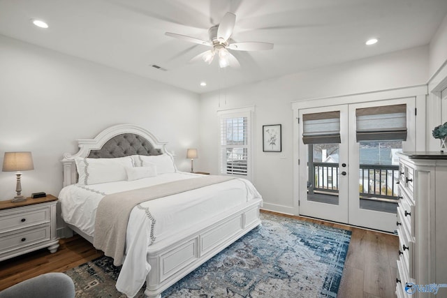 bedroom featuring recessed lighting, wood finished floors, visible vents, access to outside, and french doors