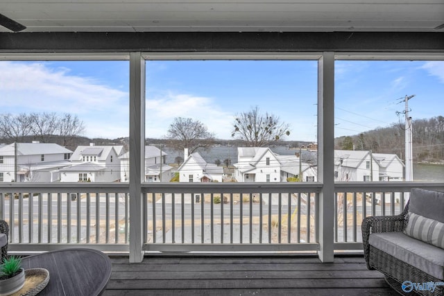 wooden terrace with a residential view