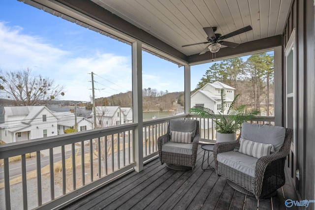 wooden deck featuring a ceiling fan