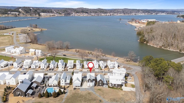 birds eye view of property featuring a residential view and a water view