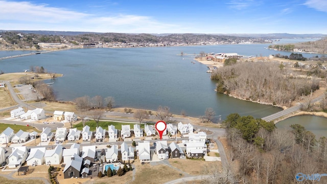 birds eye view of property featuring a water view and a residential view