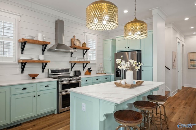 kitchen with stainless steel appliances, visible vents, range hood, open shelves, and light wood finished floors