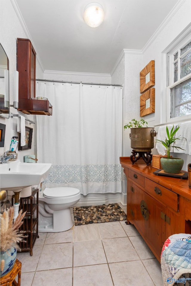 bathroom with tile patterned floors, crown molding, shower / tub combo, and toilet