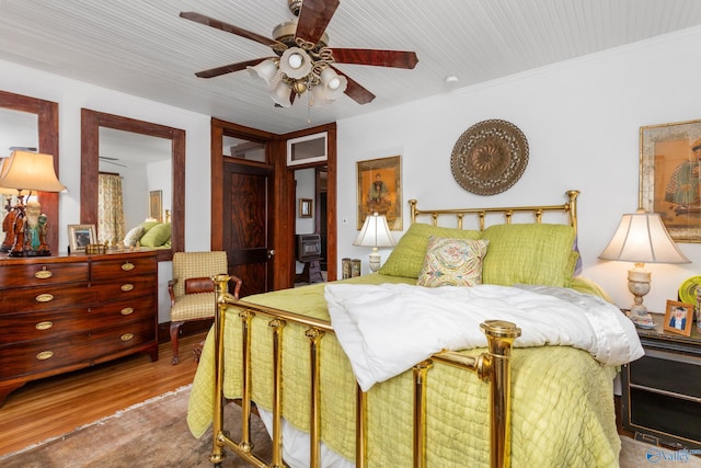 bedroom featuring hardwood / wood-style flooring and ceiling fan