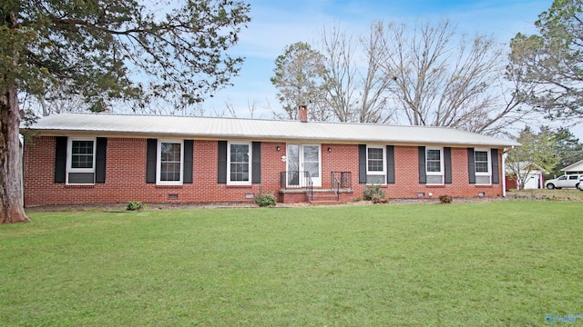 ranch-style home featuring metal roof, a chimney, a front lawn, and crawl space