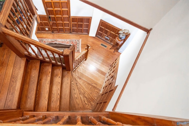 stairway featuring wood-type flooring