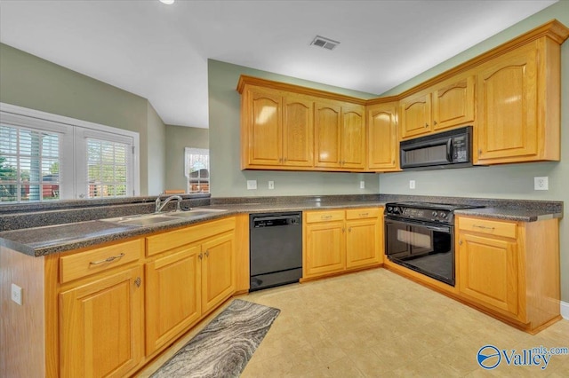 147 Singletree Dr, Hazel Green, AL 35750 - kitchen with a peninsula, visible vents, black appliances, a sink, and dark countertops