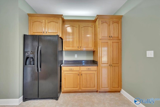 147 Singletree Dr, Hazel Green, AL 35750 - kitchen featuring baseboards, dark countertops, and black fridge with ice dispenser