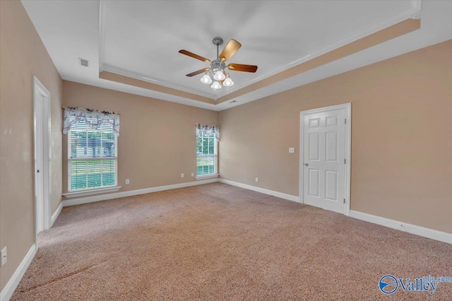 147 Singletree Dr, Hazel Green, AL 35750 - empty room featuring baseboards, a raised ceiling, crown molding, carpet floors, and ceiling fan