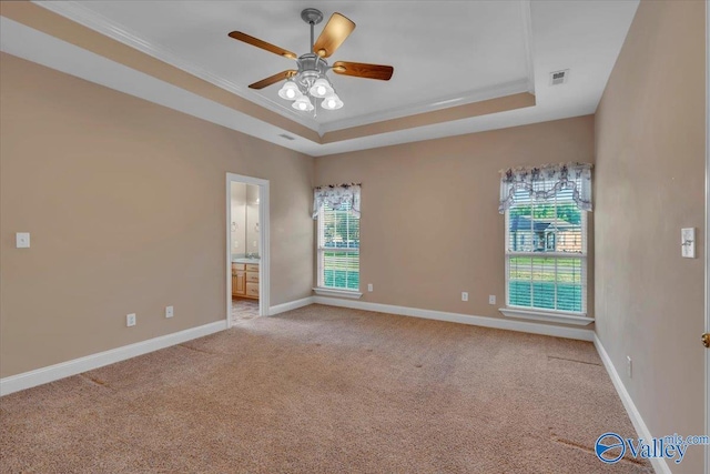 147 Singletree Dr, Hazel Green, AL 35750 - empty room with a tray ceiling, baseboards, a ceiling fan, and light carpet