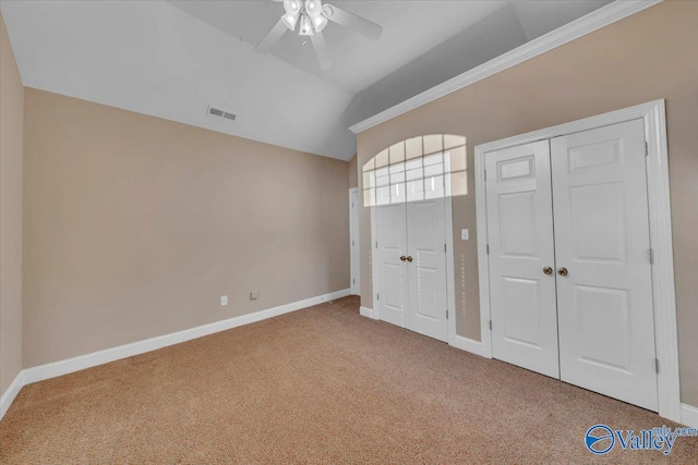 147 Singletree Dr, Hazel Green, AL 35750 - unfurnished bedroom with visible vents, baseboards, ceiling fan, vaulted ceiling, and carpet flooring