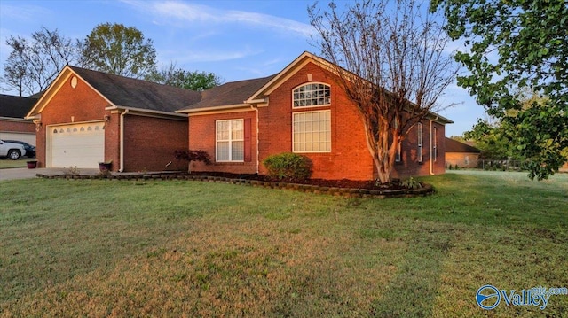 147 Singletree Dr, Hazel Green, AL 35750 - ranch-style house featuring a garage, brick siding, driveway, and a front lawn