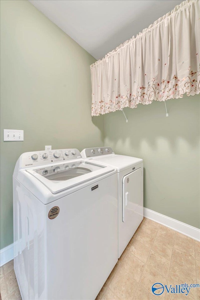 147 Singletree Dr, Hazel Green, AL 35750 - clothes washing area with washer and dryer, baseboards, and laundry area