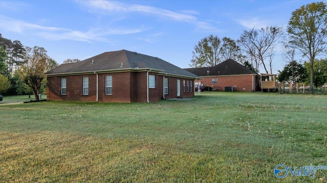 147 Singletree Dr, Hazel Green, AL 35750 - rear view of house featuring a yard and brick siding