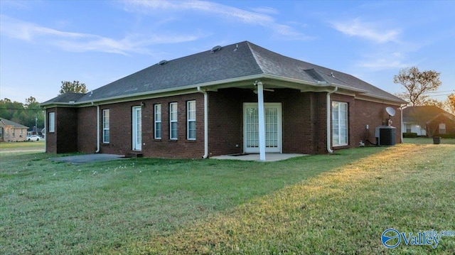 147 Singletree Dr, Hazel Green, AL 35750 - rear view of house featuring a yard, central AC, brick siding, and a patio