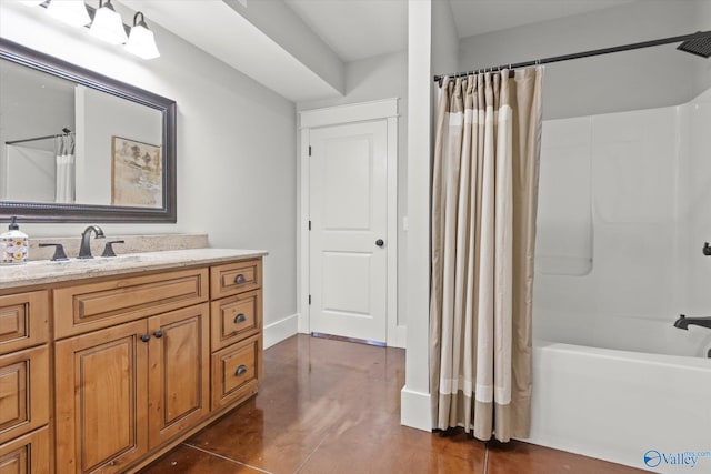 bathroom with shower / tub combo and vanity