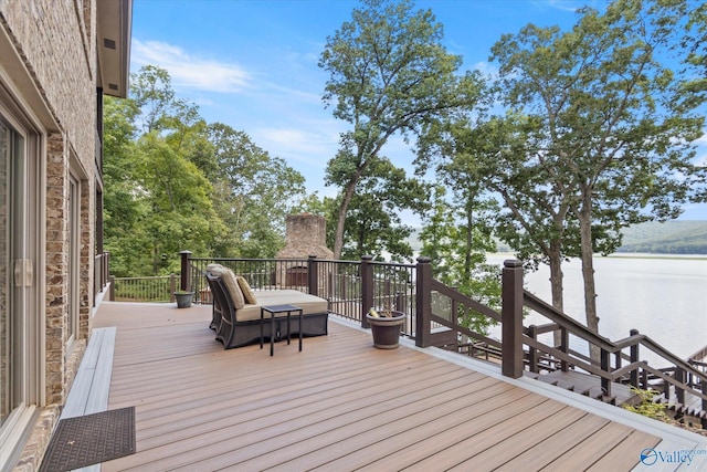 deck featuring a water view