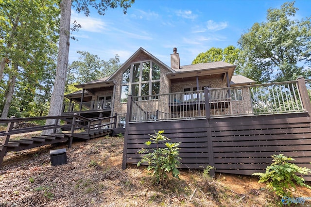 back of house with a wooden deck