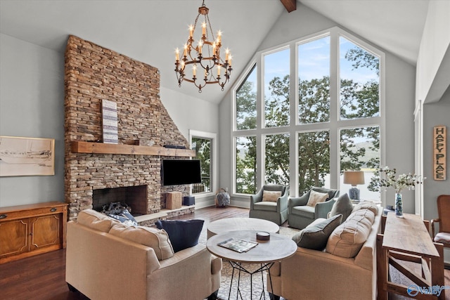 living room featuring dark wood-type flooring, a fireplace, high vaulted ceiling, and a wealth of natural light