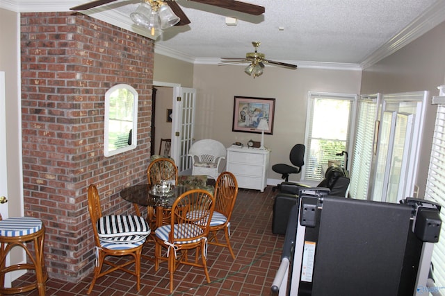 dining area with a textured ceiling and ornamental molding