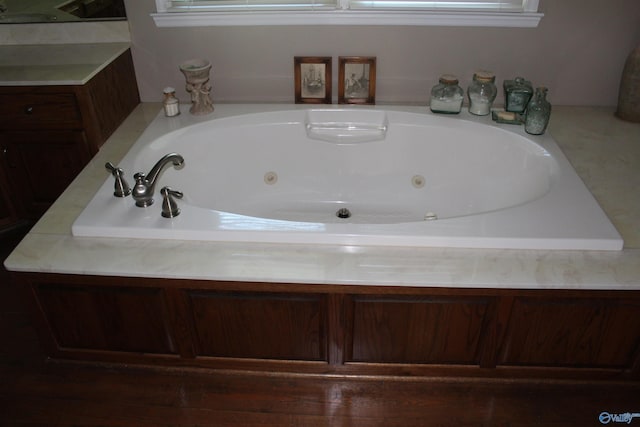 bathroom featuring a tub to relax in