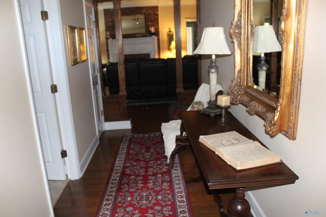 hall with dark hardwood / wood-style floors