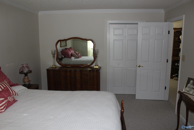 carpeted bedroom with crown molding, a closet, and a textured ceiling